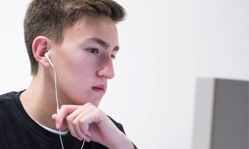 Student looking at a computer