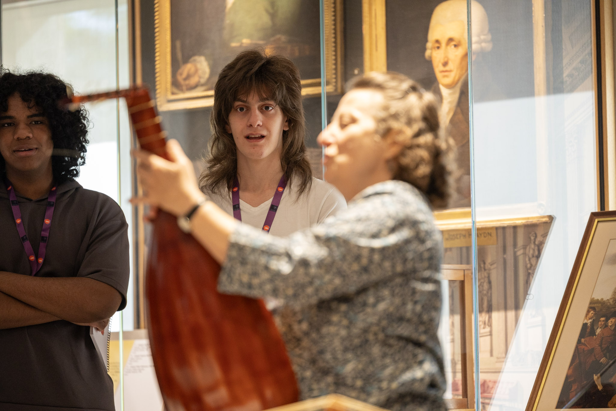 student being shown historic instrument