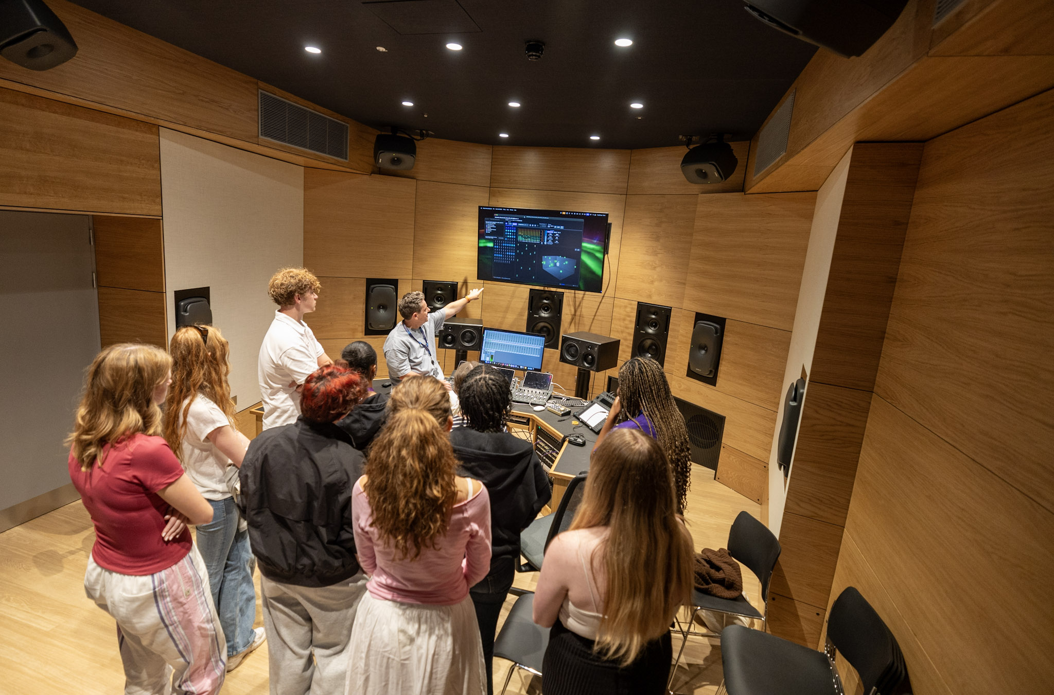 tutor teaching students in music studio