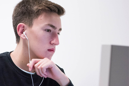 A student sitting at a computer